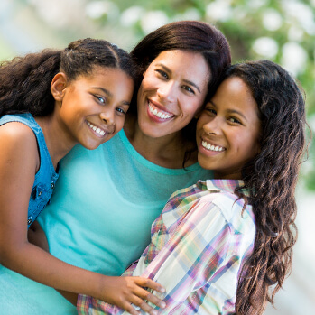 proud mother with her two daughters